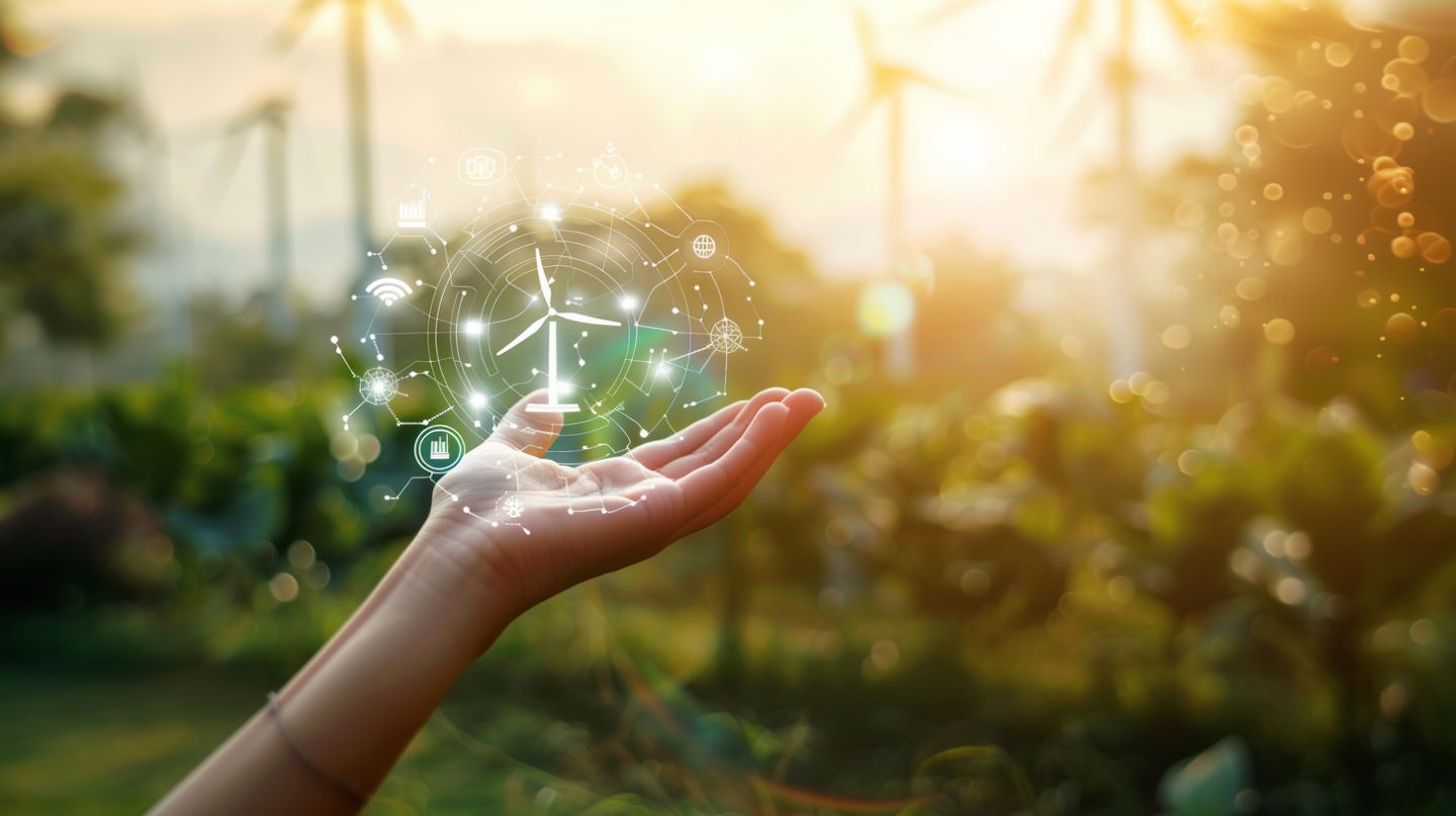 Digitales Energiemanagement und Energiesysteme Studium: eine Hand hält ein Windkraft-Symbol umringt von digitalen Icons